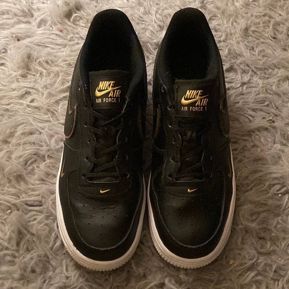 Black and gold Nike Air Force 1